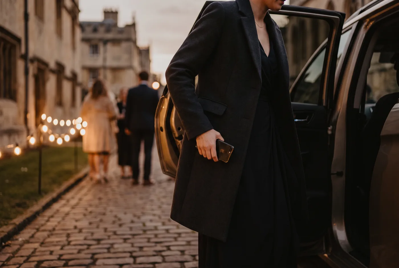 A guest arriving at an evening event venue
